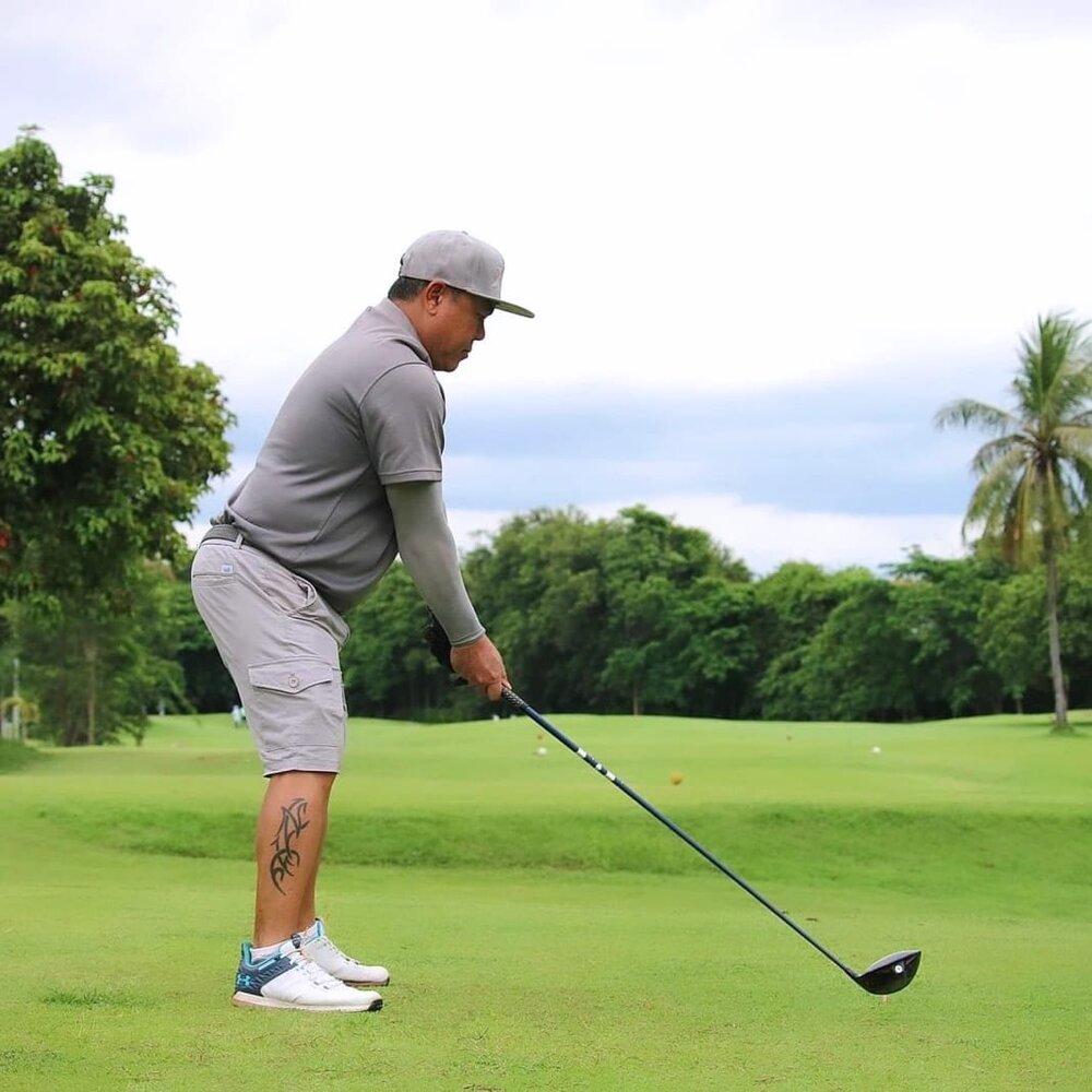Golfer mid-swing at address, analyzed by Golf & Gains Swing Check